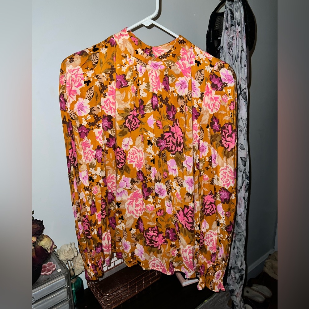 High colored floral blouse